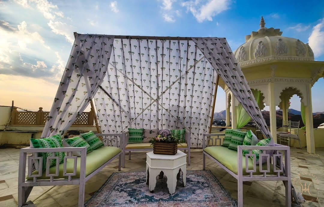 Hands holding white wedding bouquet with roses and baby's breath